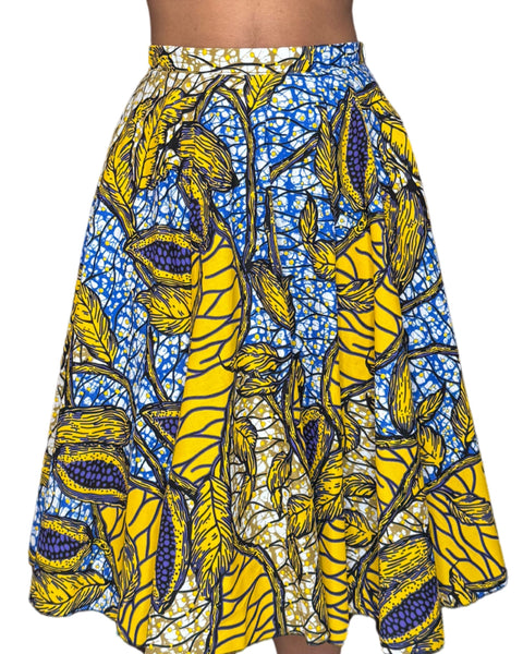 Jupe midi wax jaune et bleue aux motifs feuillages tropicaux. Taille haute, coton 100 %, confection artisanale française.
