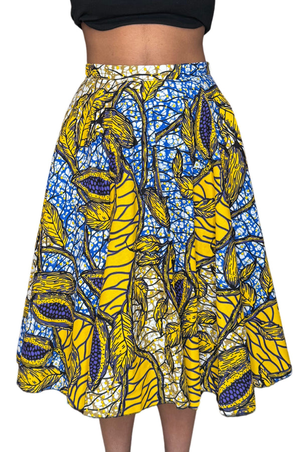Jupe midi wax jaune et bleue aux motifs feuillages tropicaux. Taille haute, coton 100 %, confection artisanale française.