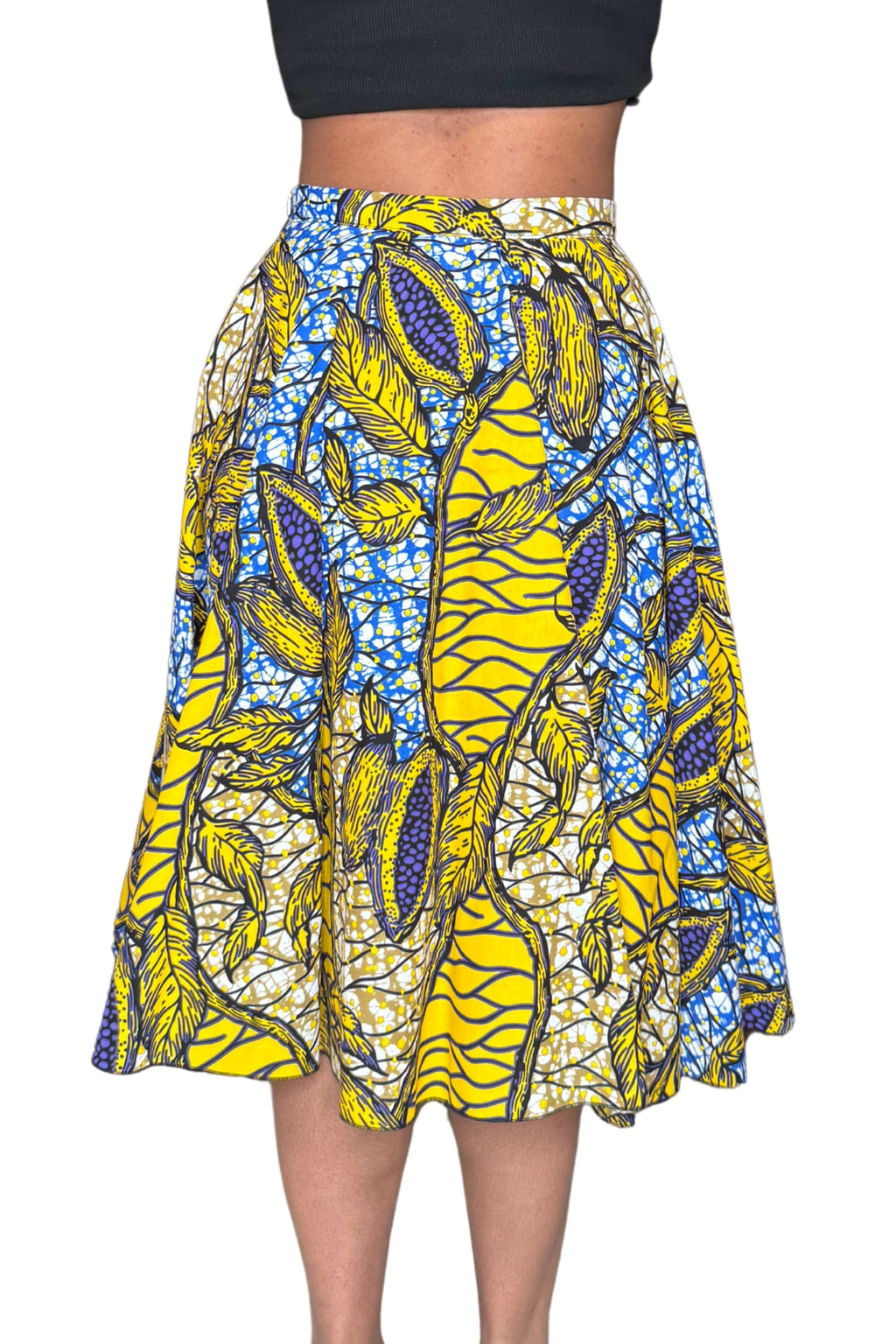 Jupe midi wax jaune et bleue aux motifs feuillages tropicaux. Taille haute, coton 100 %, confection artisanale française.