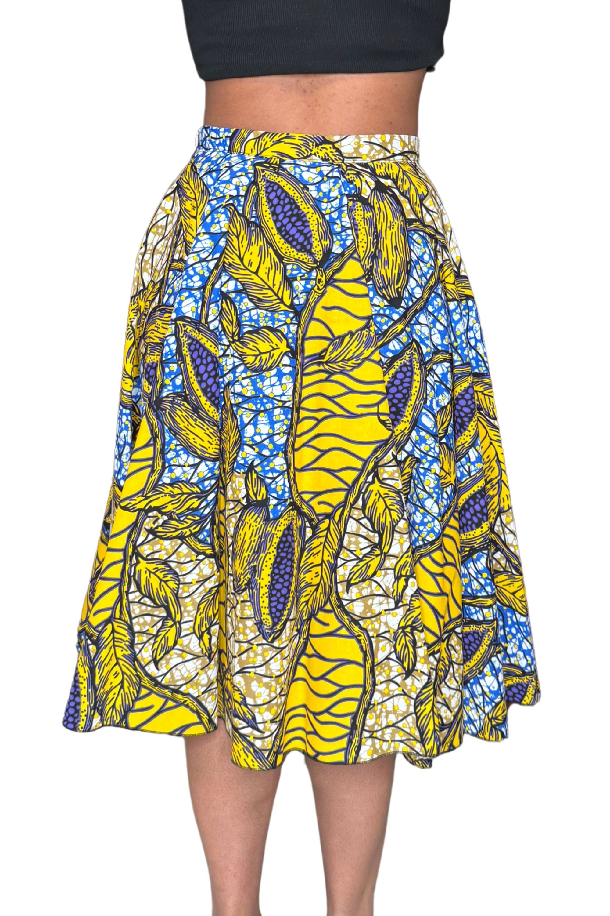 Jupe midi wax jaune et bleue aux motifs feuillages tropicaux. Taille haute, coton 100 %, confection artisanale française.