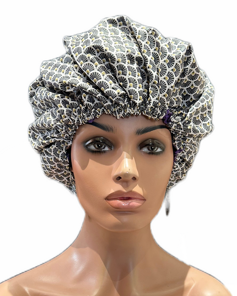 Le Bonnet de Nuit et de Douche Colorful Black est en Satin à l'intérieur (pour ne pas dessécher vos cheveux) et en coton imperméabilisé à l'extérieur. Fabriqué main.